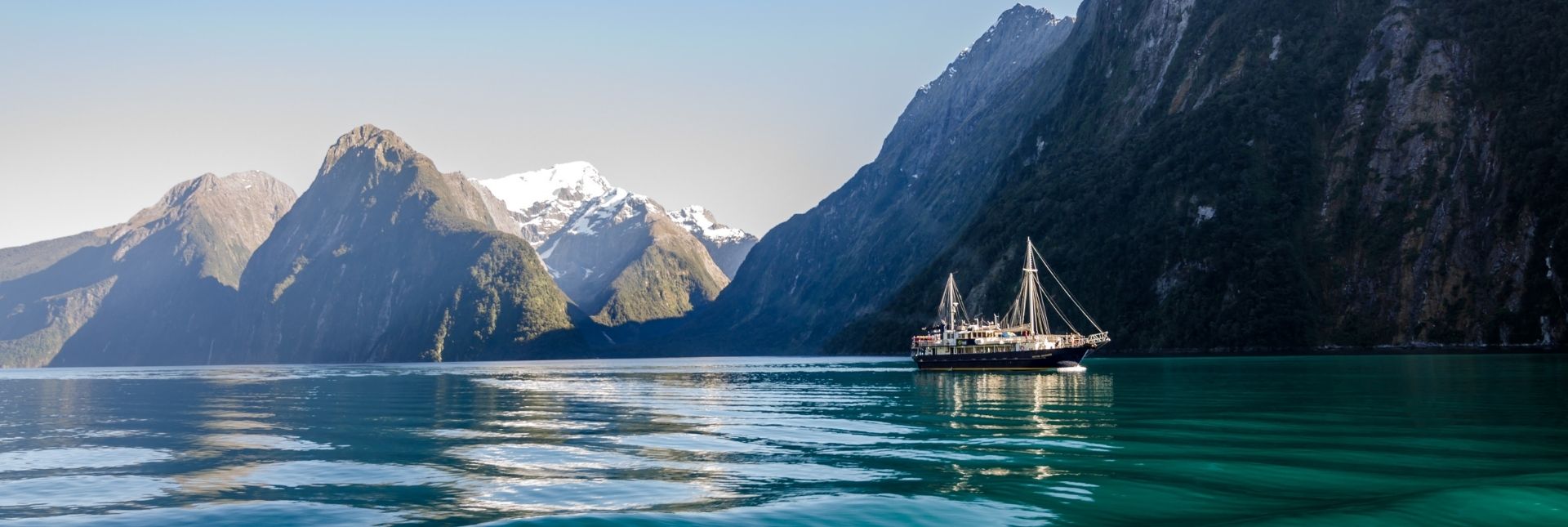 Milford Sound with Cruise ship during sunrise during early morning 